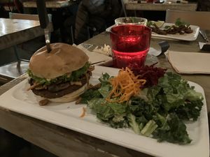 Burger with salad  at MeeT on Main in Vancouver
