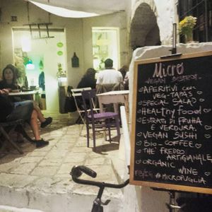 the outside view and the tables at Micro in Cisternino
