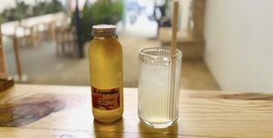 Fresh lemon juice & Dr. Turmeric Kombucha to combat the heat 😶‍🌫️  at Ivegan Supershop Xuan Thuy - Healthy Plant Based Cafe in Ho Chi Minh City