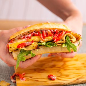 Introducing our new craveable Turkey Melt, filled to the brim with warm turkey, smoked gouda, roasted pepper confit, dijonaise, and arugula on a toasted ciabatta roll! at Veggie Grill in Corte Madera