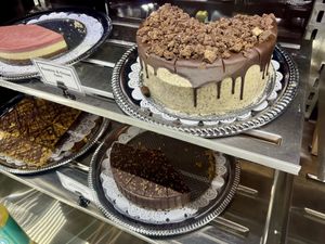 Cookies & cream cake (top right), Neapolitan cheesecake (top left), peanut butter bars (bottom left) and chocolate mousse torte (bottom right).  at Viva in Tacoma