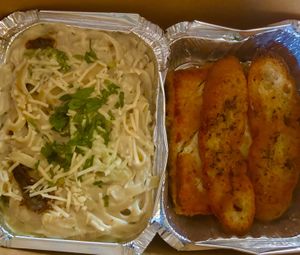 Chickun fettuccine & garlic breadd  at Viva in Tacoma