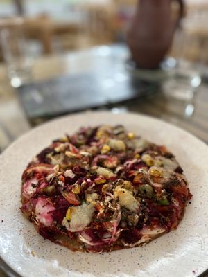 Vegan pizza 🍕 tastes amazing, but is very small. It really tastes amazing though    at Kaani Nilam - Auroville in Viluppuram