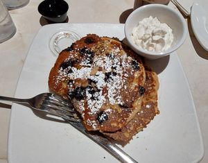 Oatmilk protein pancakes with blueberries, pistachios, agave, and whipped coconut cream at Silver Diner in Cherry Hill