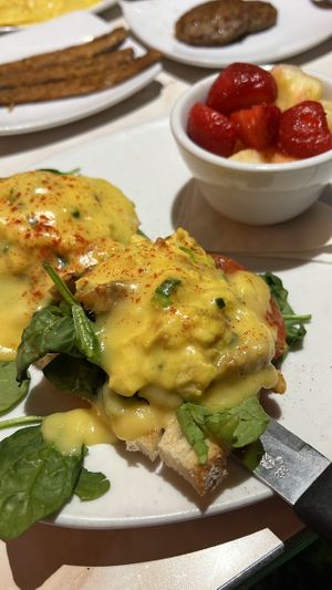 Vegan “eggs Benedict” side of fruit & tempeh “bacon"  at Silver Diner in Arlington