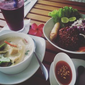 green curry combination platter with fresh juice  at Banana Leaf Vegan Thai Fusion in Canggu