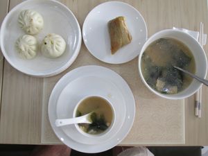 A selection (steamed savoury buns, peppery soup and steamed rice with sweet filling) from the breakfast menu at PUREST素食餐厅 (Purest Canting) in Vientiane