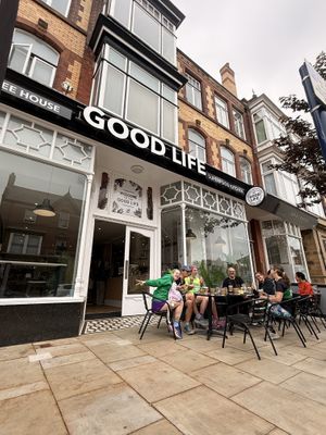 Front façade - featuring members from the Vegan Runners club  at Good Life Superfood Kitchen & Coffee House in Lytham St Annes