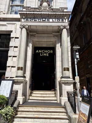 Entrance alongside outside seatingg  at The Anchor Line in Glasgow
