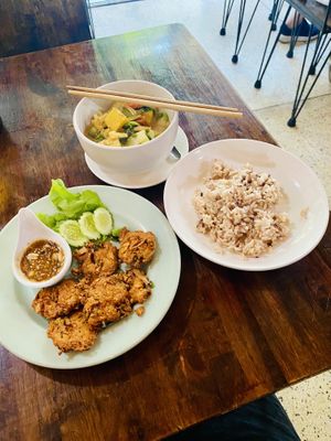 Flower blossoms with a sweet and spicy peanut sauce, massaman curry and rice  at May Kaidee Chiang Mai in Chiang Mai