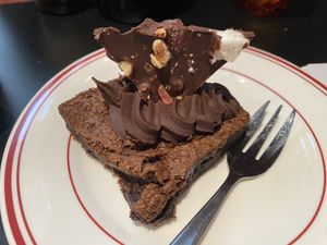 Brownie $9.50. Divine! More like a chocolate ganache cake than a brownie- very soft and rich throughout, with chocolate ganache and rocky road on top. Would be even better warm!  at Smith & Deli CBD in Melbourne