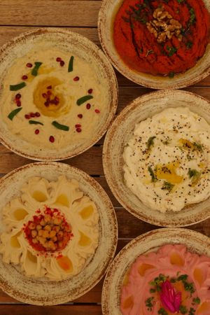 Hummus, Pink Hummus, Mutabbal, Muhammara, Garlic "Feta" Creme at NAR in Munich