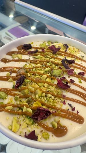 Create your own - biscoff crumble, cherry filling, vegan pudding (not on menu, ask for it!), crushed pistachio, biscoff sauce, rose petals at Crumb Bar in Edmonton
