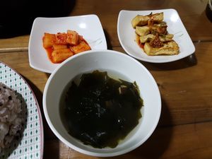 Algae soup, tofu and kimchi (sides) at Dajeon Cafe in Busan