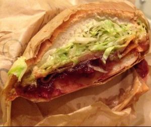 Vegan Pilgrim (vegan turkey, cranberry sauce, Sriracha, vegan dirty sauce + lettuce) on french bread at Ike's in Mesa