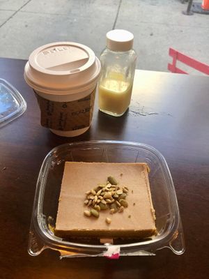 I ordered a hot beverage, Dandy Blend Latte with my choice of soy milk. I sprinkled left-over seeds from the Raw Chicago Rolls onto my pie.   at Chicago Raw - Huron St in Chicago