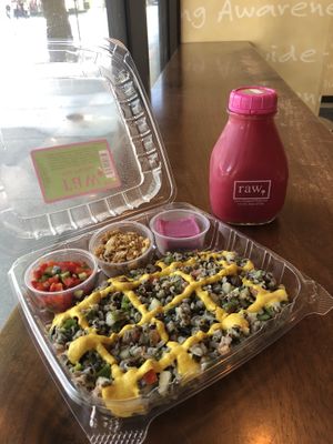 Sprouted wild rice with turmeric cashew yellow sauce & cold pressed red cabbage, ginger, lemon juice  at Chicago Raw - Huron St in Chicago