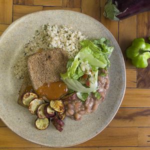 Breadcrumbs aubergine with whole cateto rice, beans and sweet potatoes with salad. at Veggies na Praca in Sao Paulo
