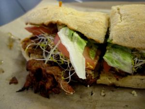 SHIITAKE TERIYAKI “CHICKEN”. Blend of shiitake mushrooms with fresh ginger, organic tamari, green peppers, lettuce, tomato, alfalfa sprouts.

Served on organic kamut ciabatta.

It's pretty tasty! at Copper Branch - Atwater in Montreal