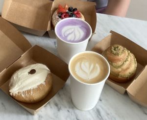 Chocolate Maritozzo, Fruit Croissant Tart, Pistachio Swirl. Vanilla Latte & Ube Latte. All superb and fresh!  at Take a Bite and Smile – Artisan Bakery & Café in South West London
