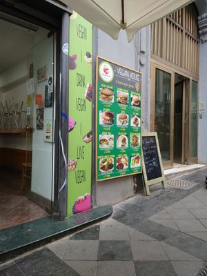 Menu on the wall outside at Vegan Art in Naples