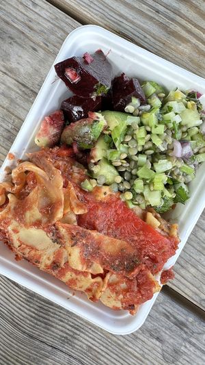 Lasagne with beet/avocado salad and put lentil salad with celeryy  at Vegan Garden London - Food Stand in South East London