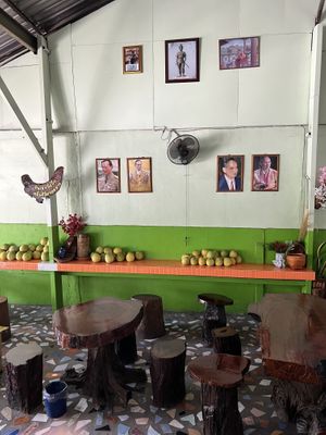 You can enjoy your meals on a wooden table.  at Tamachat in Chiang Rai