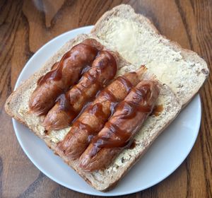 Sausage sandwich with HP sauce  at Thyme - Premier Inn Manchester Airport  in Manchester