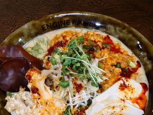 ZESTY RED MISO TOFU-VEGAN / Spicy ramen finished with house-made tofu,rich spicy red miso, and plant-based soy mince. / Allergy info: Wheat, Sesame, Orange, Soybeans at ENGINE SHINJUKU RAMEN in Tokyo