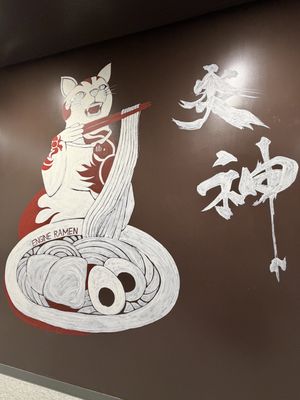 Decoration/artwork next to the entrance .  at ENGINE SHINJUKU RAMEN in Tokyo