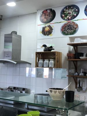 Above the coffee and the sugar you see the owner of the shop (presumably) at Falafel Abu Dany in Larnaca