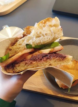 Focaccia with olive paste, tomato, and basil at Olmo Coffee&Co in Mem Martins