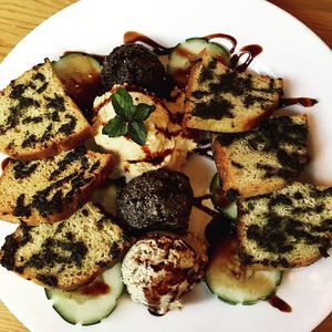 Homemade crostini with artichoke and crimini mushroom, creamy baba ganoush, and kalamata olives at Postcards in Hanalei