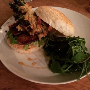 Tempeh burger: smoky tempeh steaks with beetroot relish and seasonal veg fritter at Curly Kale Cafe in Cambridge