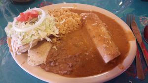 Vegan Lunch Special. 1 tofu puffy taco. 1 tofu enchilada. 2 sides. Brown rice and pinto beans. $6.45 iced tea or coffee included. at La Fiesta Patio Cafe in Universal City