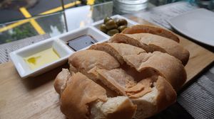 The ciabatta - one of our favorite appetizers! The bread is baked fresh and delicious, it pulls apart warm in your hands and the olive oil, vinegar, and olives chosen are delicious! We don't even LIKE olives and we devour these! at Mianto 艾果豐 in Taipei