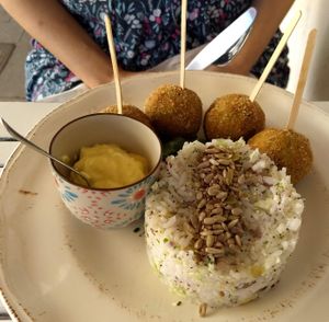Spinach and 'cheese' balls, rice and mustard 'butter' at Baobab in Fuerteventura