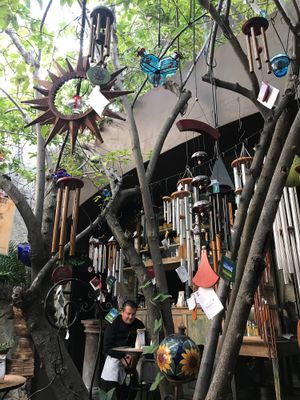 Lots of wind chimes on this shady outdoor patio at Néctar en Camino Silvestre in San Miguel De Allende
