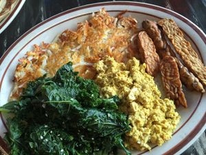 The gluten-free breakfast sampler.Wayward's signature scrambled seasoned tofu, hashbrowns, garlic steamed greens and tempeh bacon. at The Wayward Vegan in Seattle