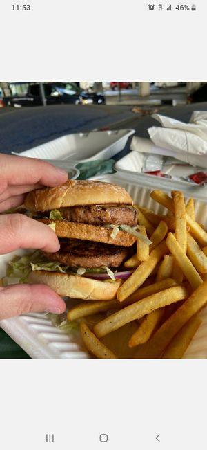 Mac daddy burger with fries at The Wayward Vegan in Seattle