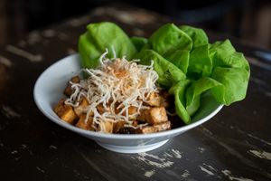 Ginger Tofu Lettuce Wrap (GF), (CN)
Marinated tofu, mushroom, water chestnuts, bib lettuce, sesame and peanut oil. at The Wayward Vegan in Seattle