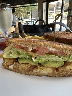 Tempeh “bacon” lettuce tomato and avocado yum! Spinach salad too  at The Wayward Vegan in Seattle