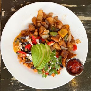 Migas (Brunch Menu): JUST Egg with vegan chorizo and potatoes. I also had a cinnamon roll! It was my birthday lunch. at The Wayward Vegan in Seattle