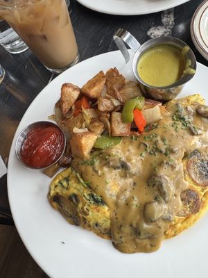 Mushroom omelet 🍄‍🟫 (with as side of hollandaise)   at The Wayward Vegan in Seattle