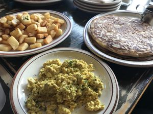 Fries, scrambled tofu and pancakes at The Wayward Vegan in Seattle