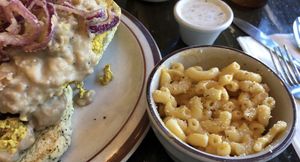 Fried “chicken” with biscuits and gravy with macaroni and cheese  at The Wayward Vegan in Seattle