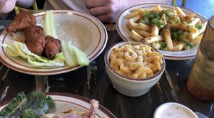 Buffalo wings, that came with vegan blue cheese... so good!!! Mac n cheese & “bacon” cheese fries.  at The Wayward Vegan in Seattle