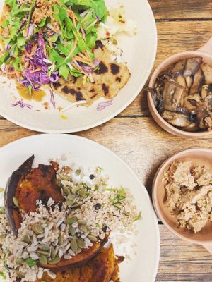 Miso pumpkin with cauliflower cous cous and daikon fritter dumplings with a side of mushrooms and almond feta  at Straight Up in Hobart