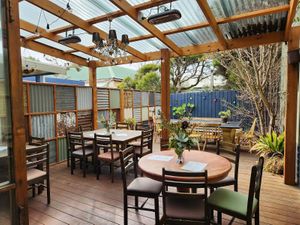Outdoor seating covered (some heating) and uncovered at REAL Pizza Pasta Salads in Port Campbell