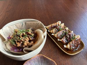 Bao with spicy Korean oyster mushrooms and Gyoza. Both tasty. Be aware that the gyoza is spicy due to the crispy chili oil  at Vegan Sushi Bar in Utrecht